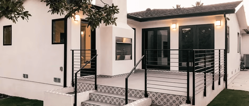 Stunning modern remodel uses black window and patio door frames